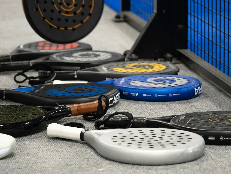 Rackets and bags left together between matches.